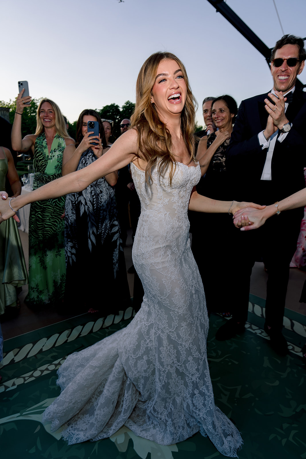 Bride smiling during an editorial flash-lit dance moment at Villa Baulieu